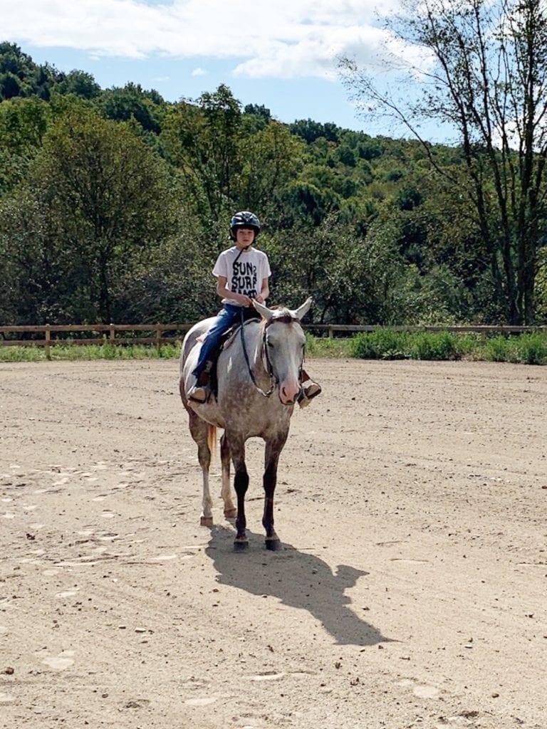 Noah riding a horse