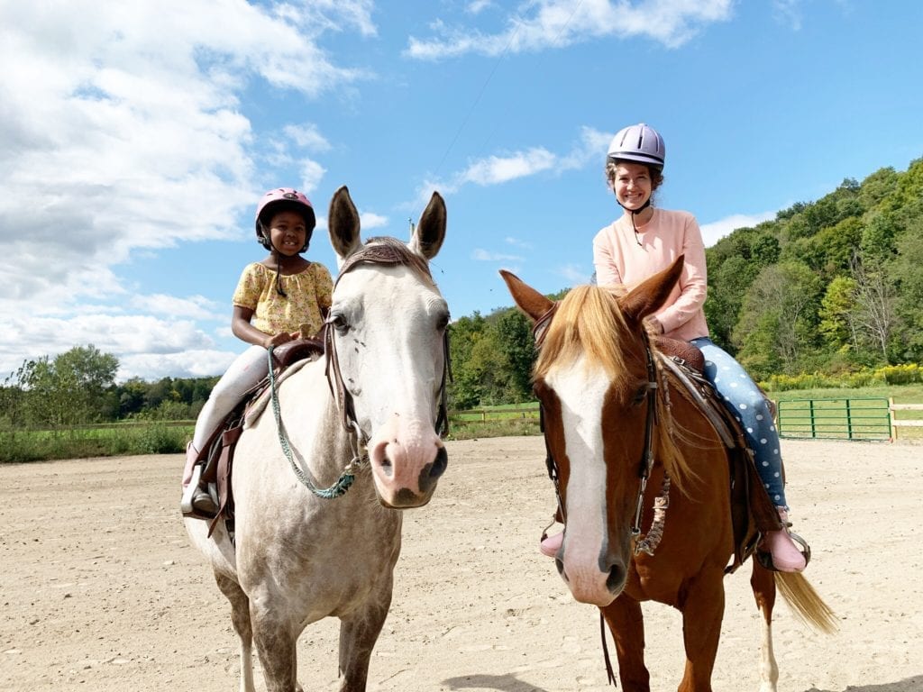 Lindsey and Libby riding horseback