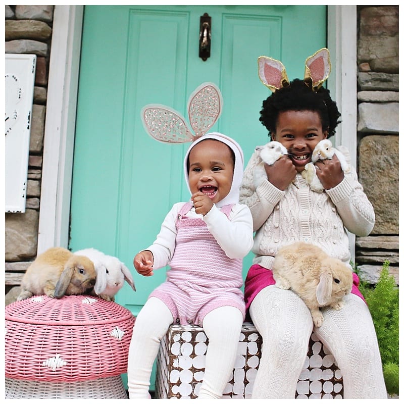 girls wearing boden holding bunnies